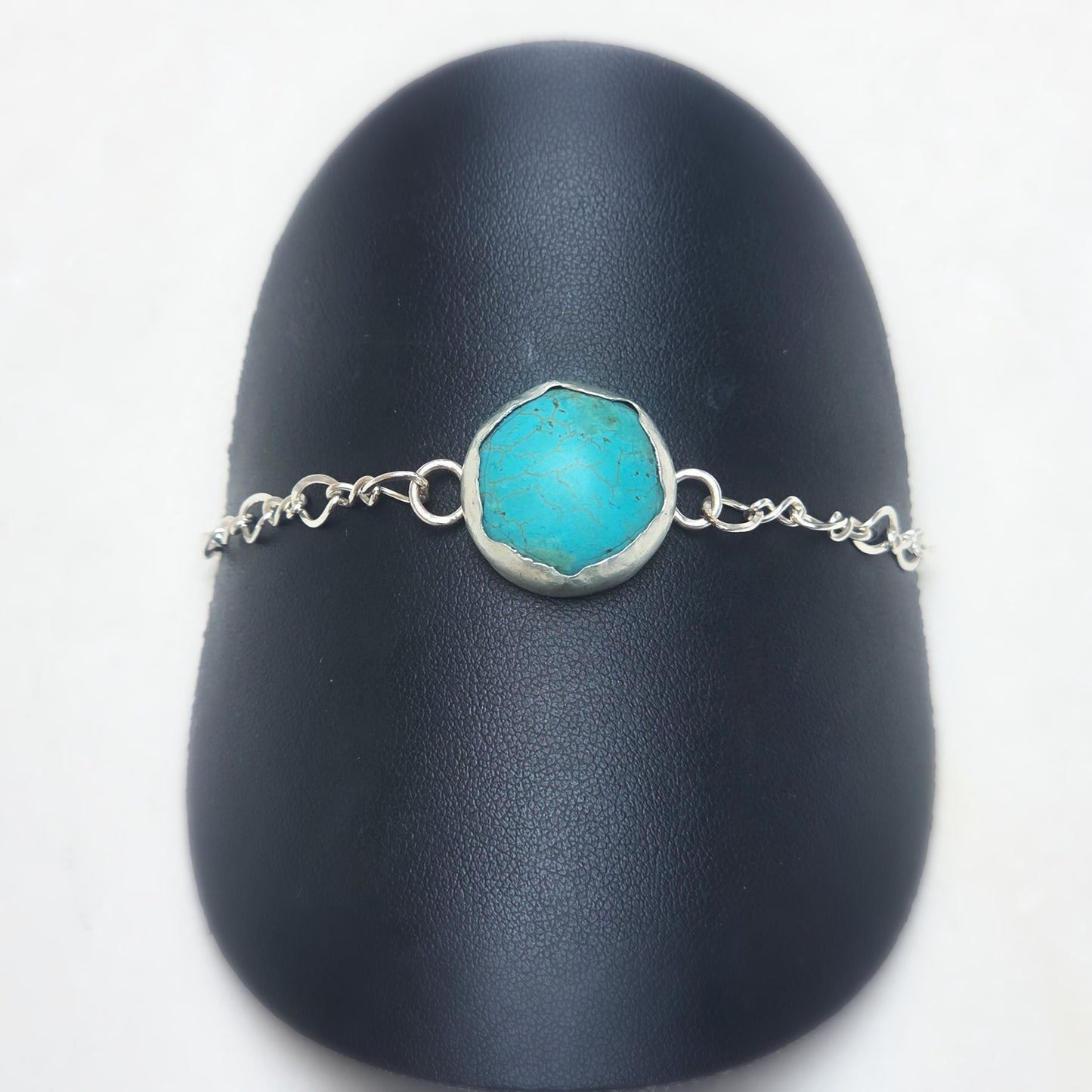 Eternal Spirit Turquoise Bracelet displayed on black stand.