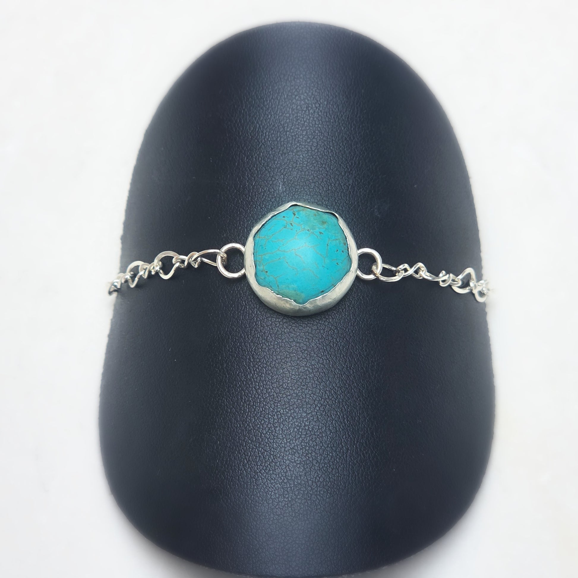 Eternal Spirit Turquoise Bracelet displayed on black stand.