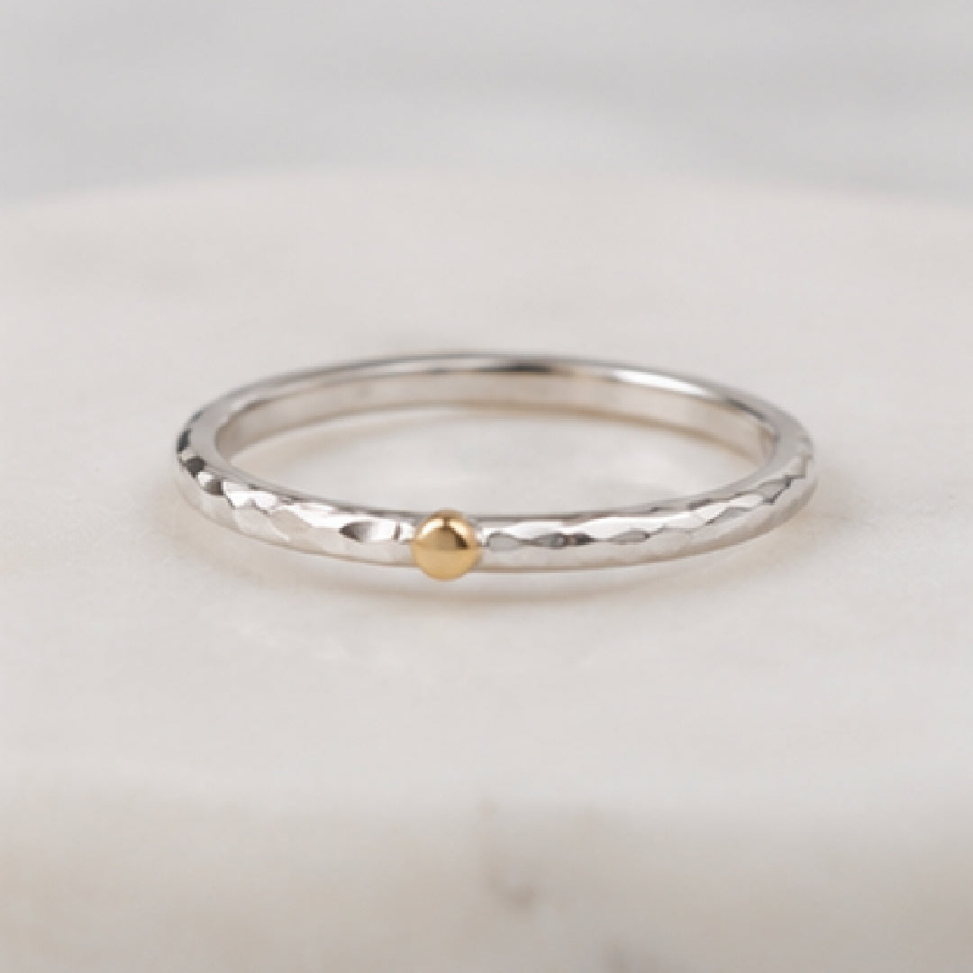 The Golden Moment Ring featuring a hand-forged Argentium silver band with a solid 14k yellow gold accent.