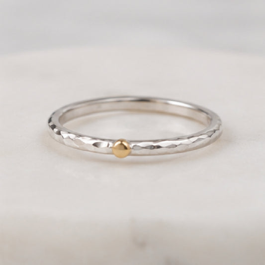 The Golden Moment Ring featuring a hand-forged Argentium silver band with a solid 14k yellow gold accent.