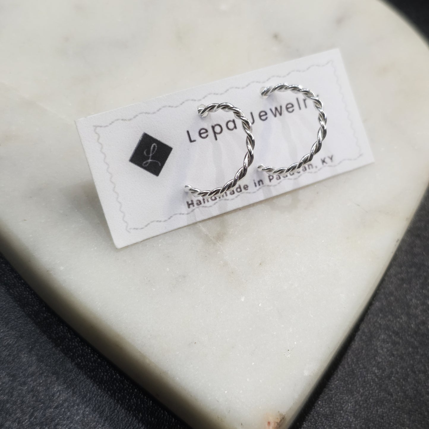 Lepa Jewelry twisted half hoop stud earrings, minimalist and chic on earring card