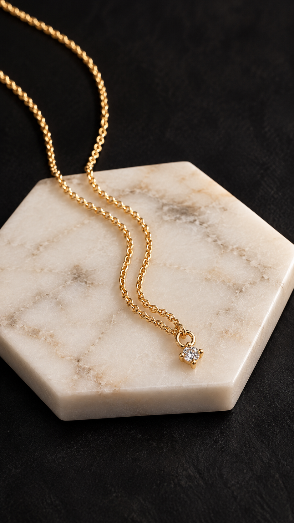 Sultry Drop Necklace by Lepa Jewelry featuring a sparkling cubic zirconia in a four-prong gold-filled setting suspended from a gold-filled rolo chain.