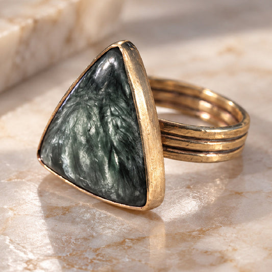 The Vesper Ring by Lepa Jewelry featuring triangular Siberian seraphinite in a sculptural brass setting