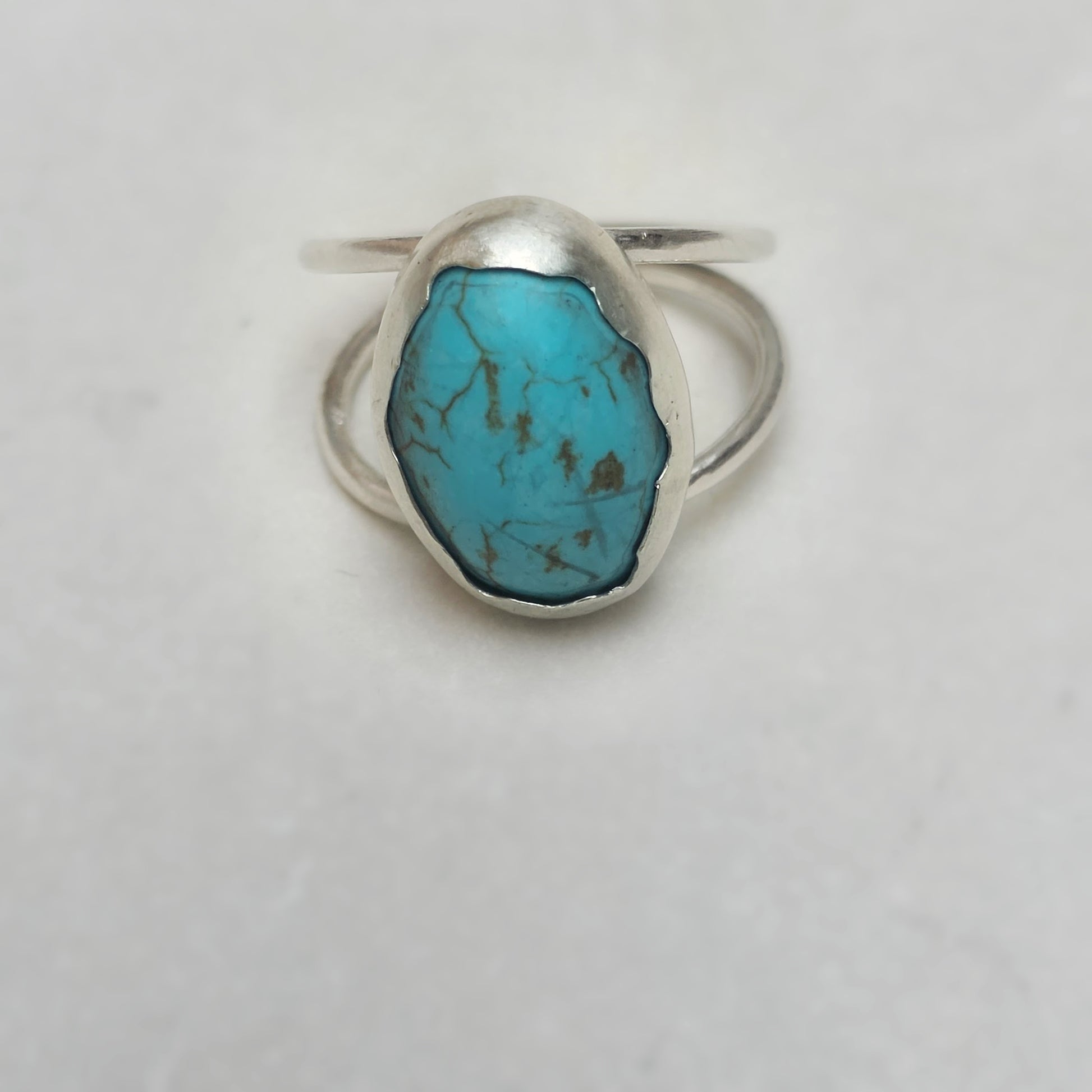 Voice of the Sky Turquoise Ring flatlay front view.