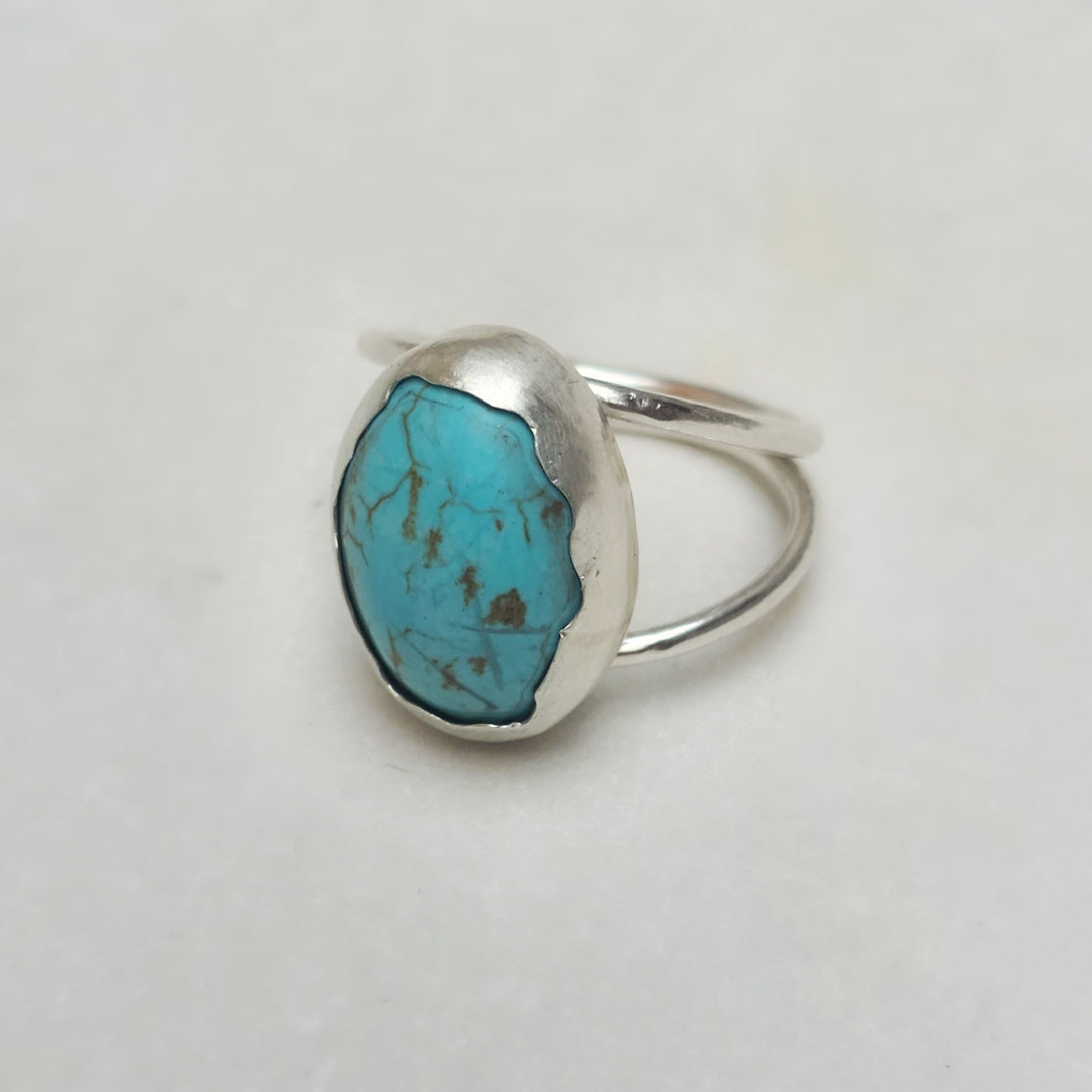 Side angle of turquoise ring bezel in Argentium silver.