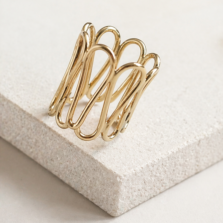 Side view of Aegis Ring by Lepa Jewelry showing sculptural multi-curve gold design