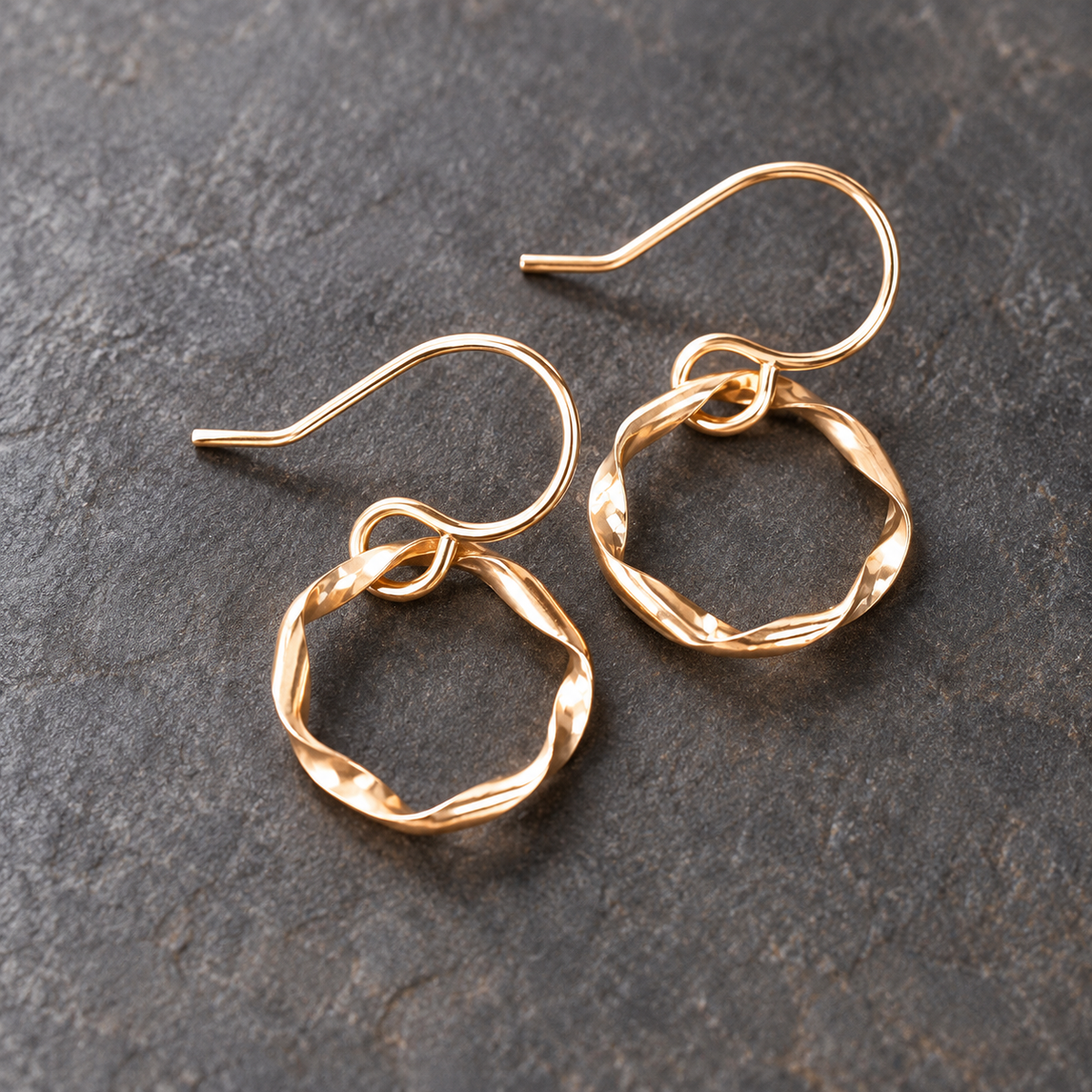 Gold Strata Day Hoops by Lepa Jewelry, 14K gold-filled twisted hoop earrings on slate background