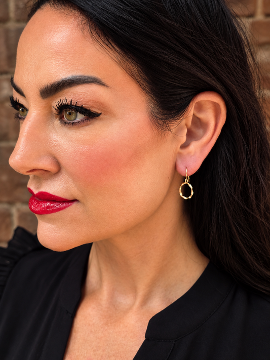 Woman wearing Gold Strata Day Hoops by Lepa Jewelry, 10mm gold hoop earrings with French ear wire