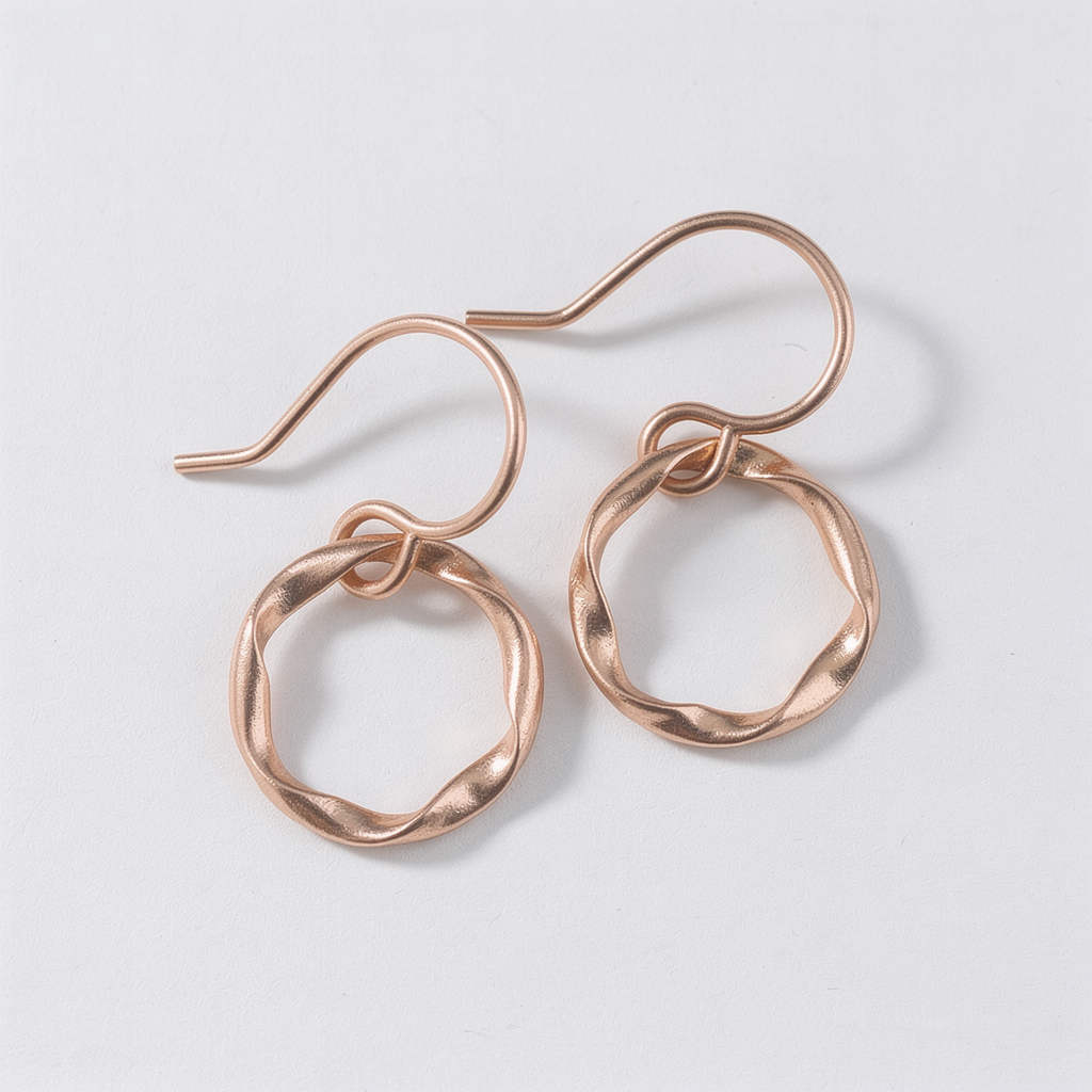 Lepa Jewelry Gold Strata Day Hoops, rose gold-toned twisted hoop earrings on white background