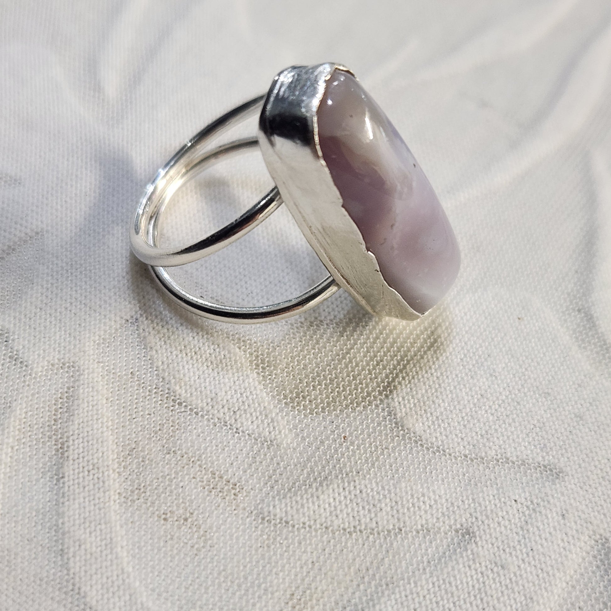 Close-up of the bezel and stone texture, showing intricate silverwork and natural patterns in the agate
