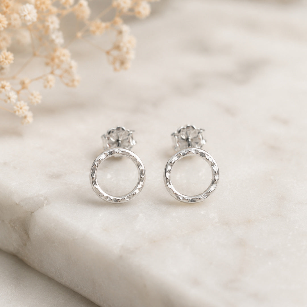 Front view of Argentium silver Karma Stud earrings with hammered open circle design, modern minimalist jewelry