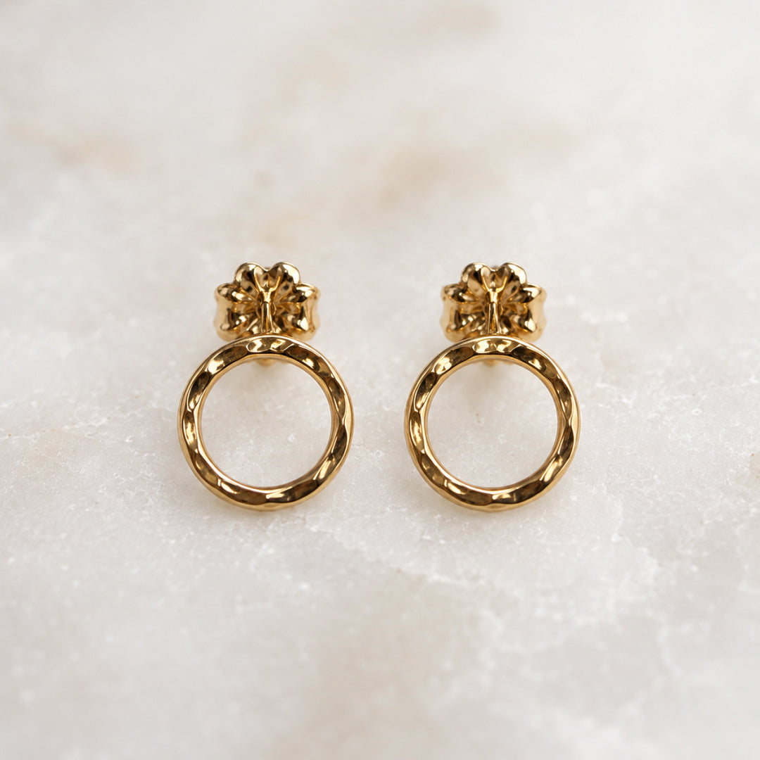 Front view of gold-filled Karma Stud earrings with hammered open circle design, minimal modern jewelry