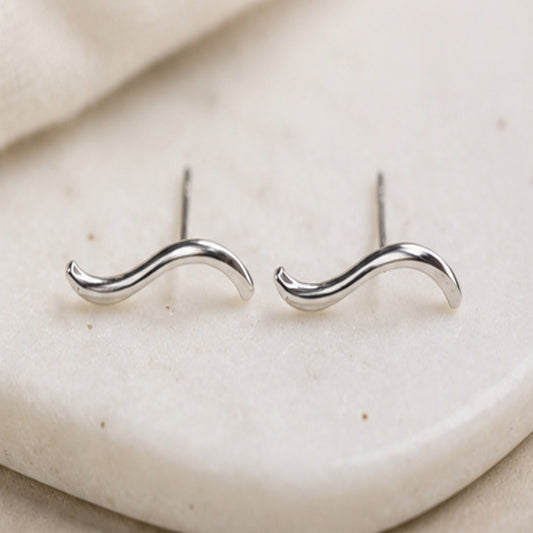 Argentium sterling silver sculptural wave stud earrings by Lepa Jewelry, minimalist curved studs designed to flow with the natural line of the ear