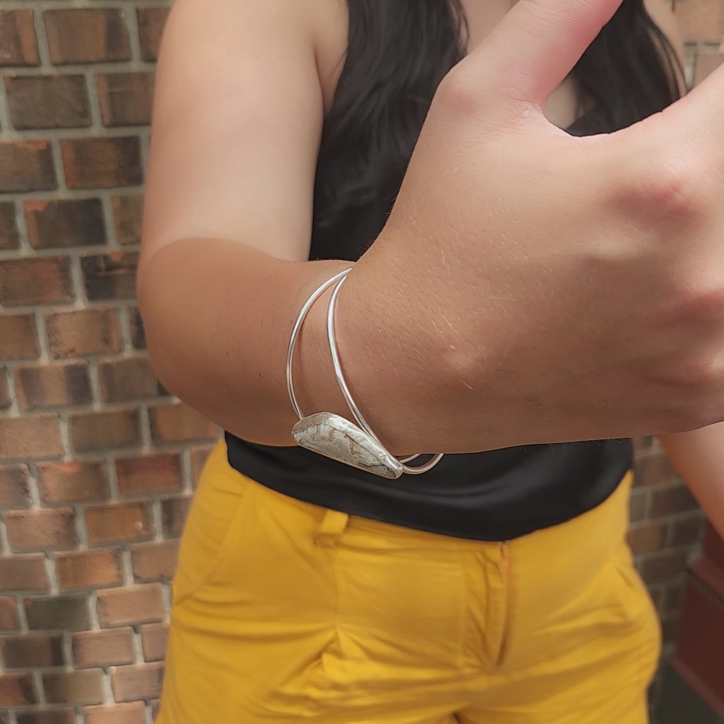 360-degree view video of Crazy Lace Agate triangle split cuff bracelet in sterling silver.